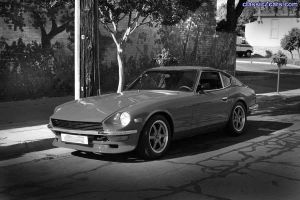 red 240z in black and white