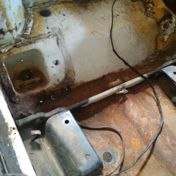 Floor pan right rear holes.jpg