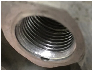 Threaded sleeve in pivot post bore.jpg